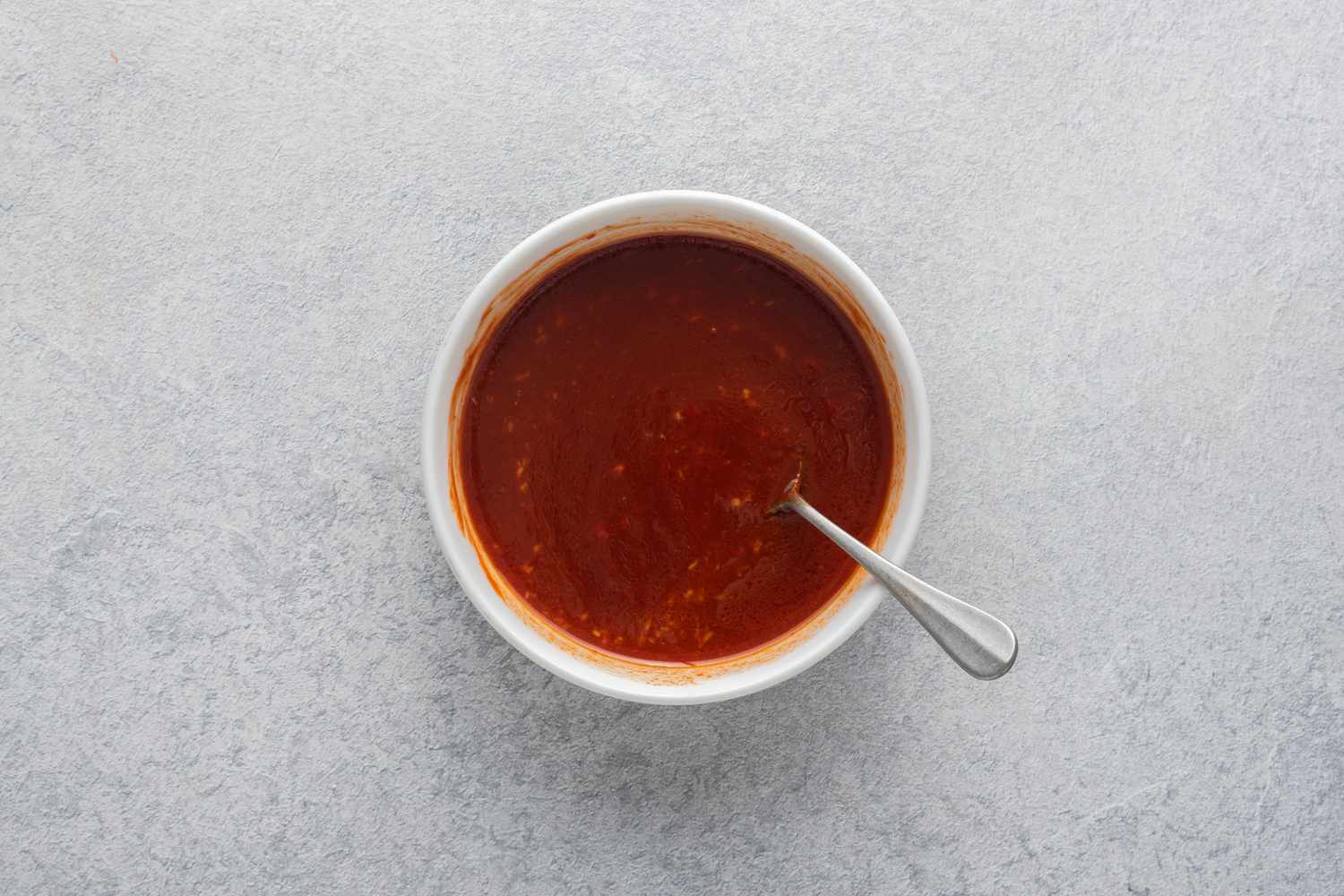 Ingredients stirred together with a spoon in a small bowl